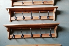 A selection of hall shelves with coat hooks