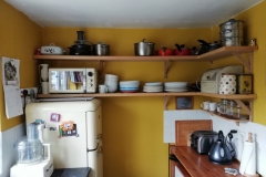 Kitchen Shelves made of reclaimed ply and pine strips from an old door frame