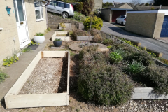 reclaimed scaffold used to build a matching pair of large raised beds