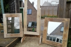 a trio of pallet wood mirrors