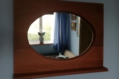 Oval mirror in mahogany frame