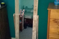 Upright mirror framed in pallet wood