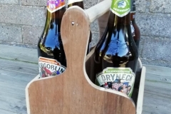 4 bottle beer caddy made from reclaimed plywood and a curtain rod as a handle